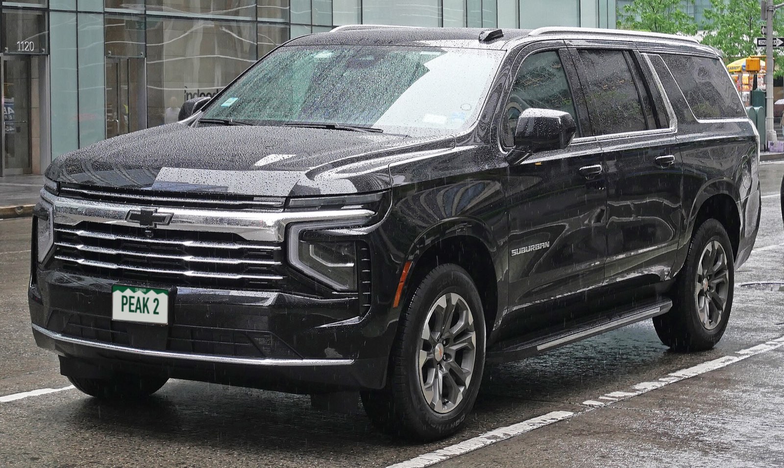 Black Chevrolet Suburban with Colorado plate PEAK 2
