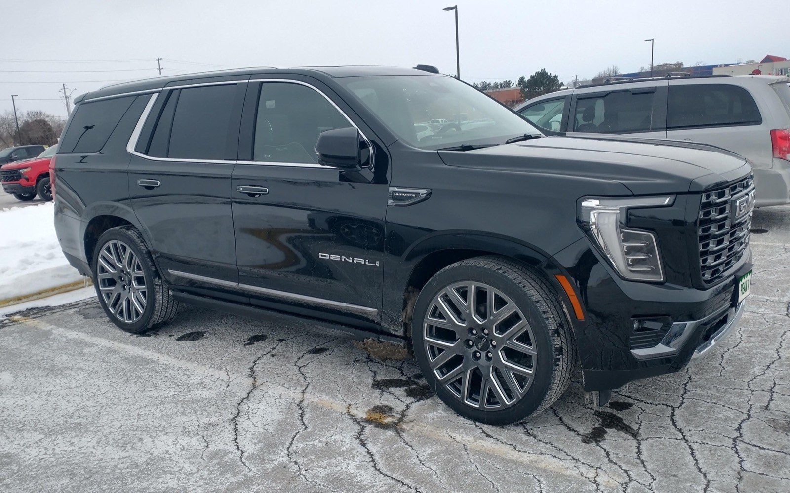 Black GMC Yukon Denali with Colorado plate PEAK 1